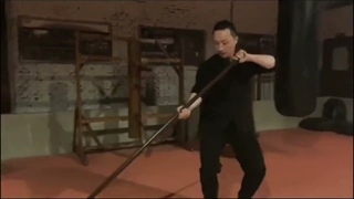 Wing Chunbottle cap opening with a long cudgel.